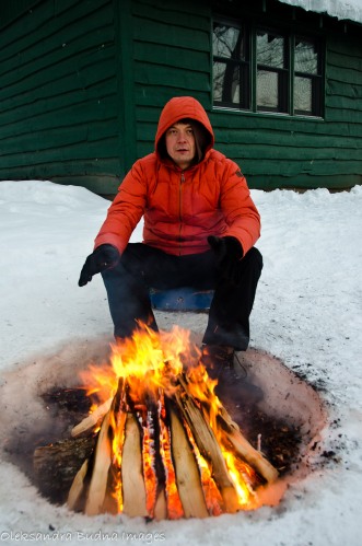 man by the fire in the winter